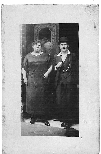 Wilson Grove, formally Salisbury Street. Eliza Tillson nee Bennett, proprietor of the Three Compasses and her son George Ernest Tillson 1922,outside the pub. X.png