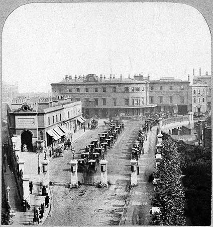 London Bridge Railway Station, with a row of waiting cabs outside c1850.  X.png