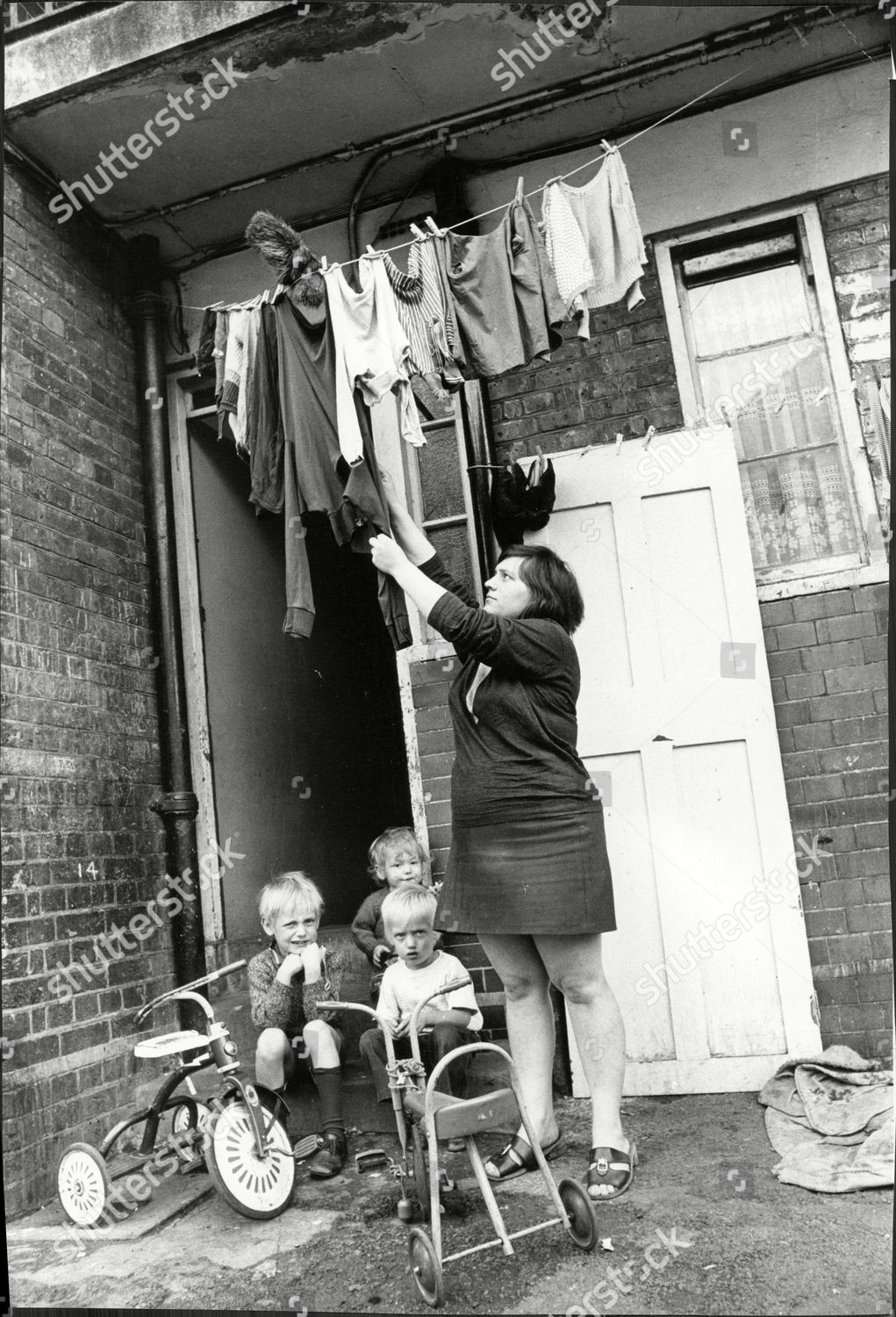 Tabard Street a mother and children outside their home at Chaucer House, Southwark c1971.  X.png