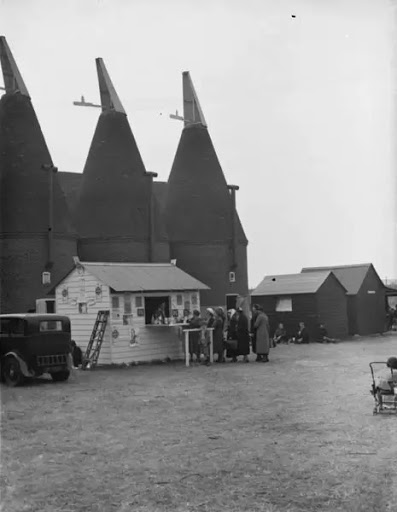 Beltring hop farm Paddock Wood, Kent. People queing up at the on-site milk bar 1938.  X.png