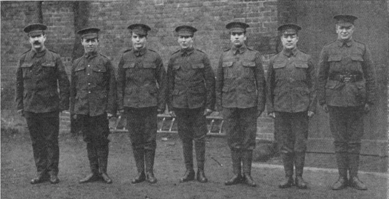 Jack Goldswain 1915, Bermondsey born boxer, 1st Surrey Rifles. Sergeant Taylor, Dick Burge, Dai Roberts, Duke Lynch, W.W. Turner, Jack Goldswain and L-CPL Pat O'Keeffe, 26 May 1915, all boxers.  X.png