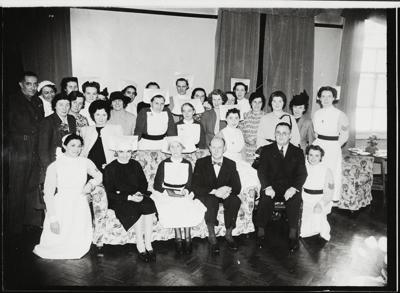 Lower Road St Olave's Hospital. A group of past and present staff of St Olave's Hospital posed at a reunion 1942.  X.png
