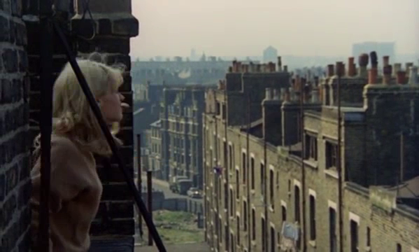 Film Poor Cow 1967. Roof of the Rodney Place tenement, Palatinate Estate Warren Buildings on Brandon Street, left of centre distance. Waste ground  bottom centre is near Eider Street.  X.png