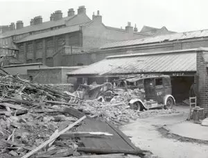 Blitz in London -- an AFS substation located in Webber Street, Southwark. with building debris covering fire appliances in the yard area.  X.png