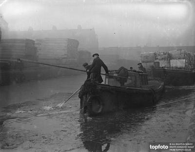 Surrey Canal at Camberwell c1936, barge men breaking the thick ice, where it has been frozen over by the severe weather.  X.png