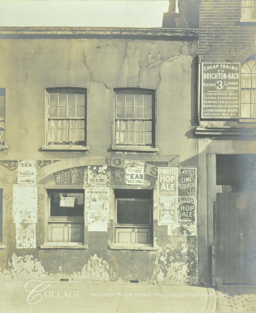 Bermondsey Square, Tower Bridge Road. Posters for Cheap trains to Brighton for 3 shillings, R. White's hop ale, lime squash and ginger beer, c1900.  X.png