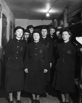 Southwark Bridge Road, AFS (Auxiliary Fire Service) women in their bunk room at Station 60, during the Second World War.  X.png