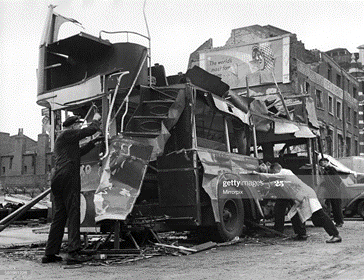 Bomb damage near Waterloo Station. A Blitzed bus caused by blast from a V1 flying bomb. June 1944.   X.png