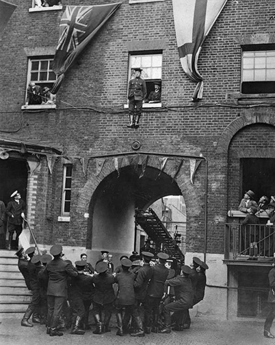 Southwark Bridge Road 1922.  A fireman jumping from a window into a safety blanket.  X.png