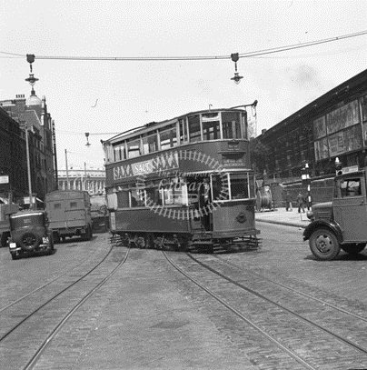 Blackfriars Road c1950, a No. 26 Tram coming out of Southwark Street (right).   X.png