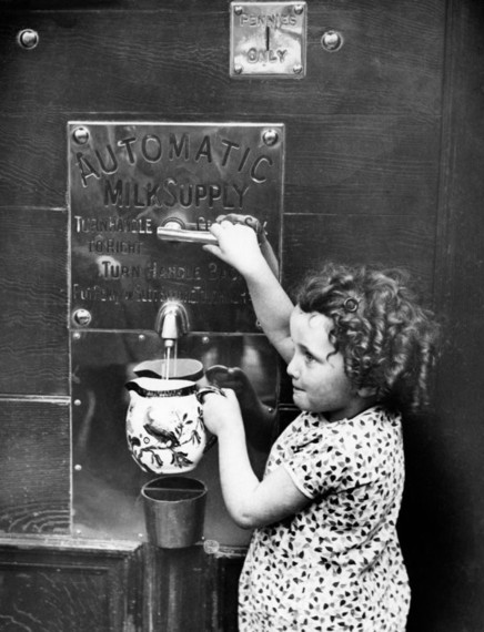 Milk vending machine in London, England, circa 1931..jpg