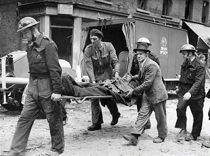 East Lane, Robot plane damage WW2. A casualty being taken to ambulance with a friend comforting him after he had helped to get him out. June 1944.  X.png