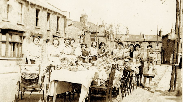 Delaford Road, VE Day Party. Brenda Watkinson (3rd child along on right).  X.png