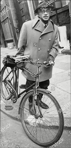 Dr Walter Rahman seen at Tower Bridge Court with his bicycle, 1971.  X.png