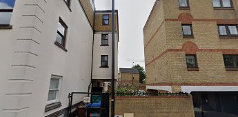 Rotherhithe Street, Surrey House is on the right, between the buildings is the location of Purnell Place.   X.png
