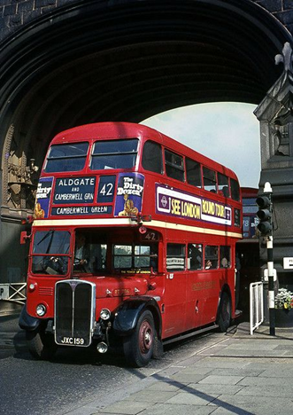 Tower Bridge, 42 bus passes under one of the towers of Tower Bridge c1967.   X.png
